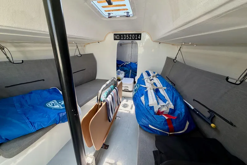 Slide: The Image of Interior of 2020 Jeanneau Sun Fast 3300 sailboat, featuring seating and storage areas. - 42