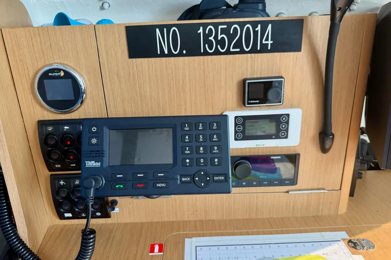 Slide: The Image of Control panel of a 2020 Jeanneau Sun Fast 3300 sailboat with navigation equipment. - 56