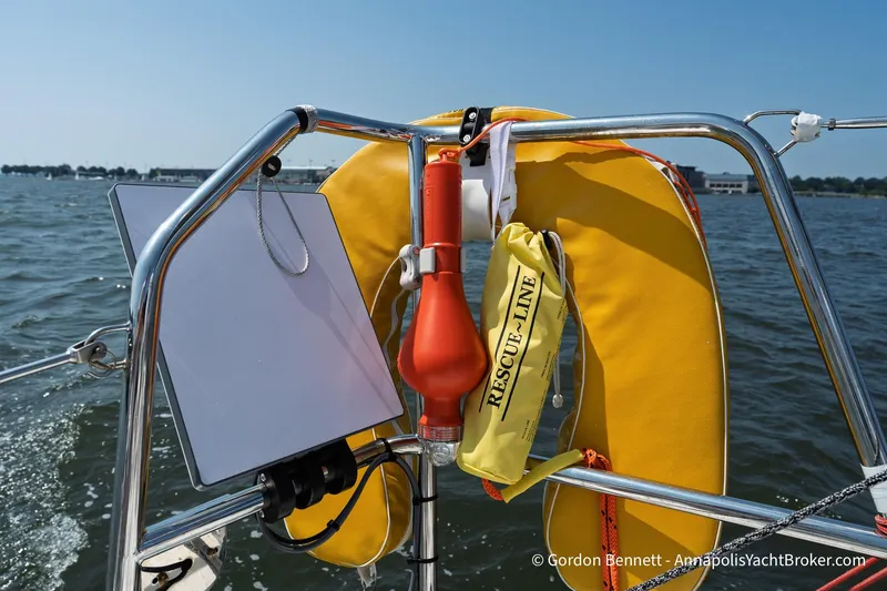 Slide: The Image of Safety equipment on Jeanneau Sun Fast 3300 yacht, featuring a life ring and rescue line. - 41