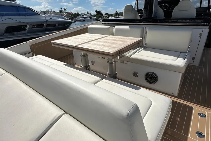 Slide: The Image of Luxurious seating area on the 2025 Solaris Power 44 Open yacht with wooden table. - 11