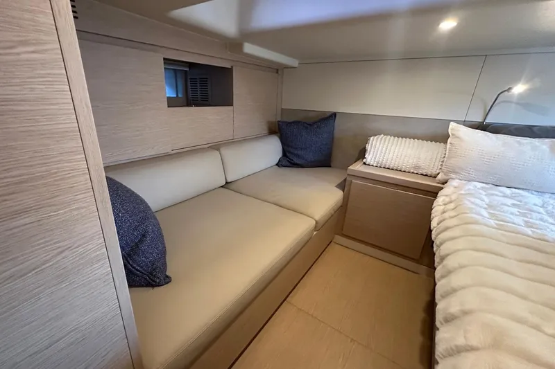 Slide: The Image of Luxurious interior of 2025 Solaris Power 44 Open yacht with cozy seating and elegant bedding. - 19