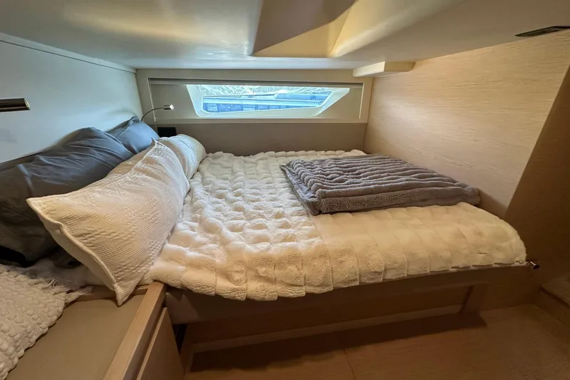 Slide: The Image of Luxurious bedroom interior of 2025 Solaris Power 44 Open yacht with cozy bedding. - 20