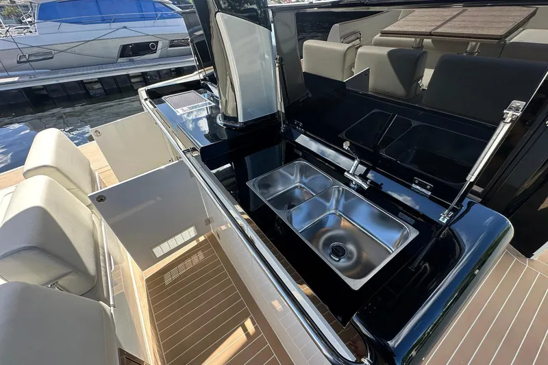 Slide: The Image of Luxurious 2025 Solaris Power 44 Open yacht with sleek outdoor kitchen and dual sinks. - 22