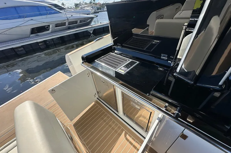 Slide: The Image of Outdoor kitchen on 2025 Solaris Power 44 Open yacht, docked by the water. - 23