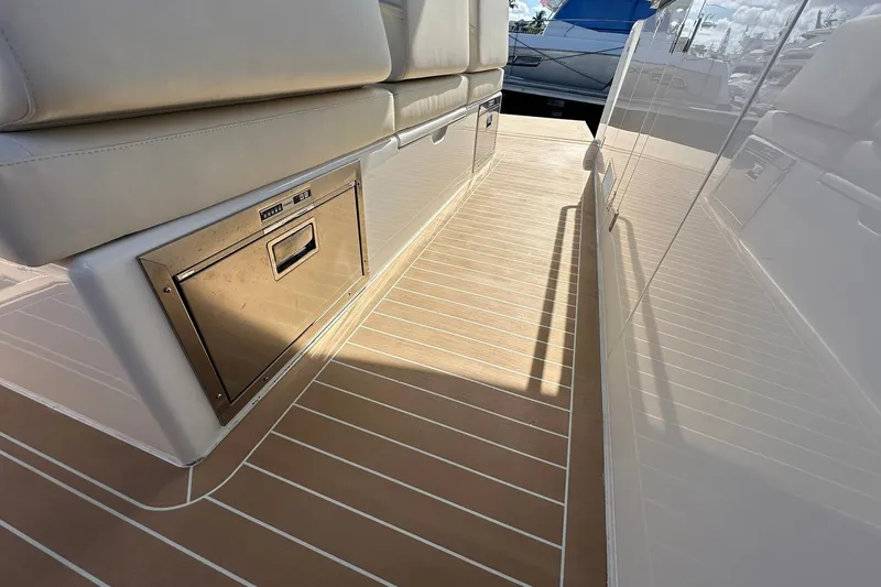 Slide: The Image of 2025 Solaris Power 44 Open yacht deck with sleek seating and integrated storage. - 24