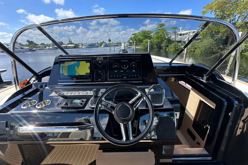 Slide: The Image of Cockpit view of 2025 Solaris Power 44 Open yacht with advanced navigation system. - 25