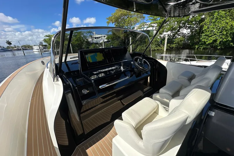 Slide: The Image of 2025 Solaris Power 44 Open yacht cockpit with modern controls and luxurious seating. - 26