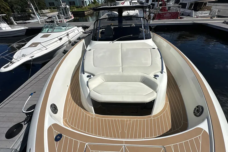 Slide: The Image of 2025 Solaris Power 44 Open yacht docked, featuring sleek design and spacious deck. - 28