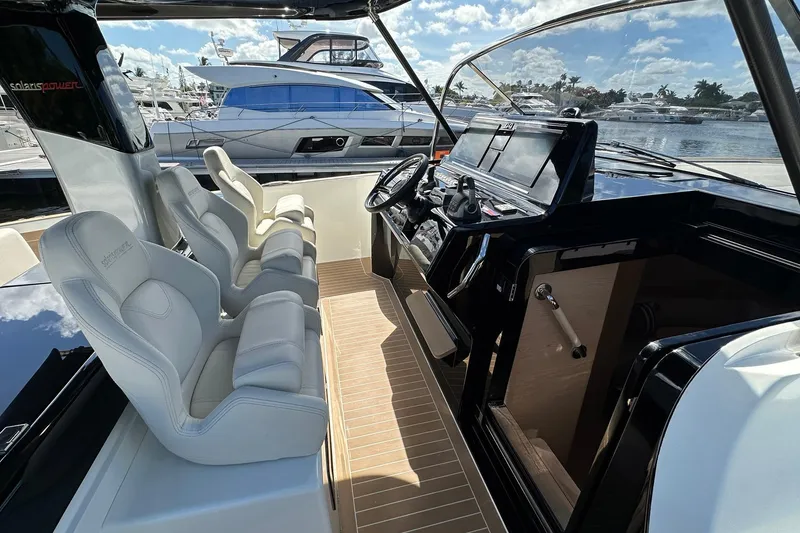 Slide: The Image of 2025 Solaris Power 44 Open yacht interior with sleek helm and luxurious seating. - 29