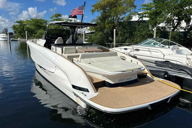 Slide: The Image of 2025 Solaris Power 44 Open yacht docked, featuring sleek design and spacious deck. - 3