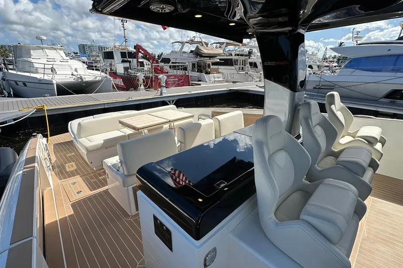 Slide: The Image of Luxurious 2025 Solaris Power 44 Open yacht interior at marina, featuring elegant seating and sleek design. - 30