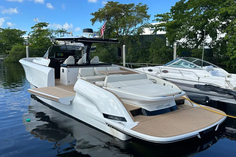 Slide: The Image of 2025 Solaris Power 44 Open yacht docked, showcasing sleek design and spacious deck. - 4