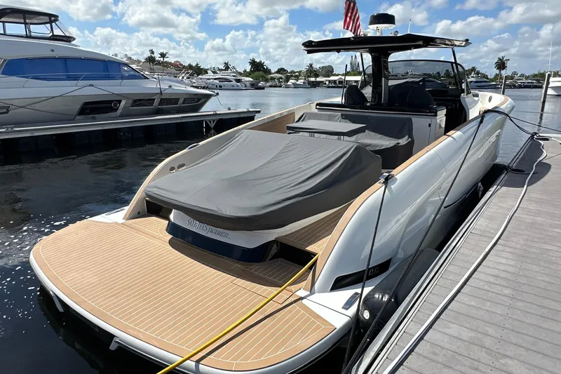 Slide: The Image of 2025 Solaris Power 44 Open yacht docked, featuring sleek design and spacious deck. - 7