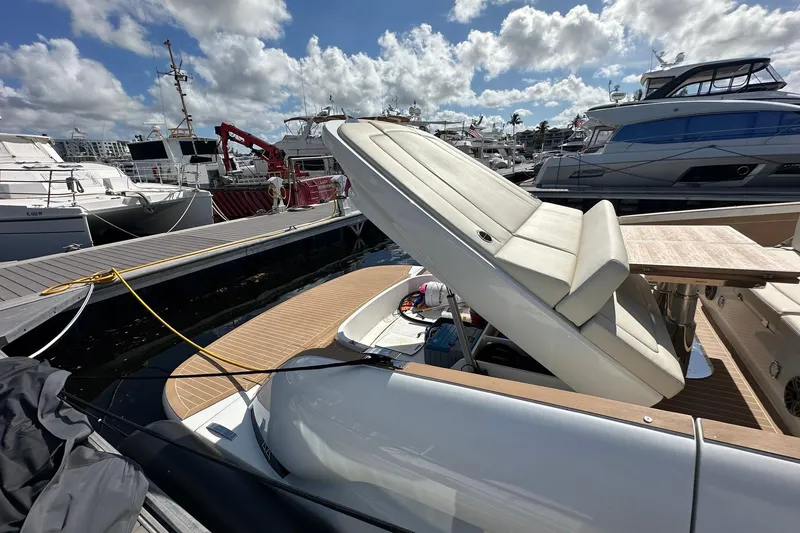 Slide: The Image of 2025 Solaris Power 44 Open yacht docked, featuring sleek design and luxurious seating. - 9