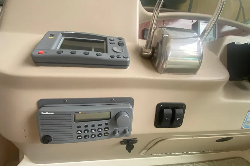 Slide: The Image of Control panel of a 2001 Sea Ray 340 Sundancer boat with navigation equipment. - 15