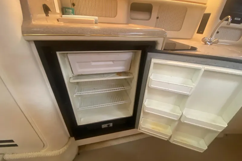 Slide: The Image of Open refrigerator inside 2001 Sea Ray 340 Sundancer yacht kitchen area. - 18