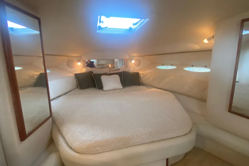 Slide: The Image of Luxurious cabin interior of 2001 Sea Ray 340 Sundancer yacht with plush bedding. - 21