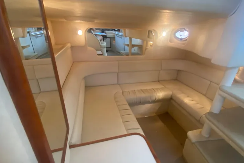 Slide: The Image of Luxurious interior of 2001 Sea Ray 340 Sundancer yacht with plush seating and ambient lighting. - 26