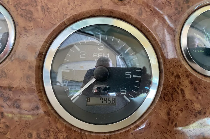 Slide: The Image of Tachometer of 2001 Sea Ray 340 Sundancer boat, displaying RPM and engine hours. - 32