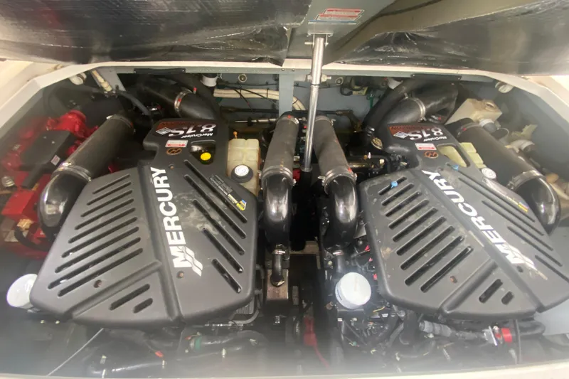 Slide: The Image of Engine compartment of a 2001 Sea Ray 340 Sundancer with twin Mercury engines. - 33