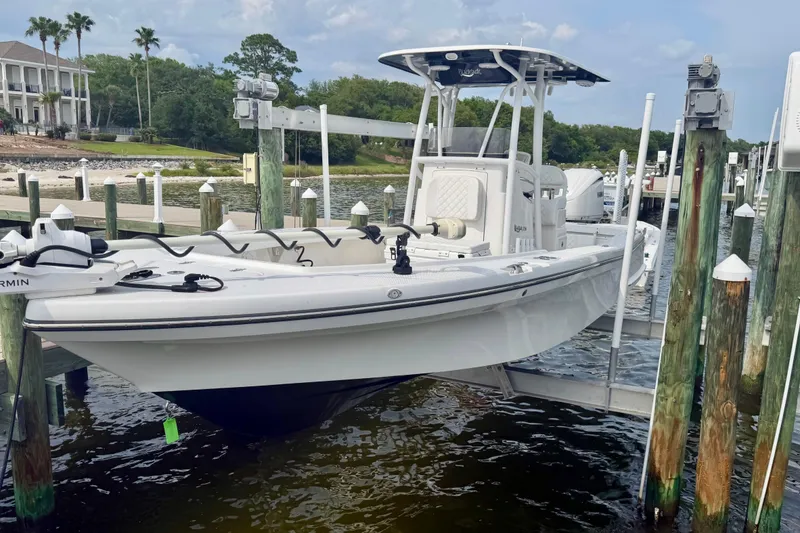 The Image of 2025 BlackJack 256 Coastal boat docked at marina, featuring sleek design and modern equipment. - 0