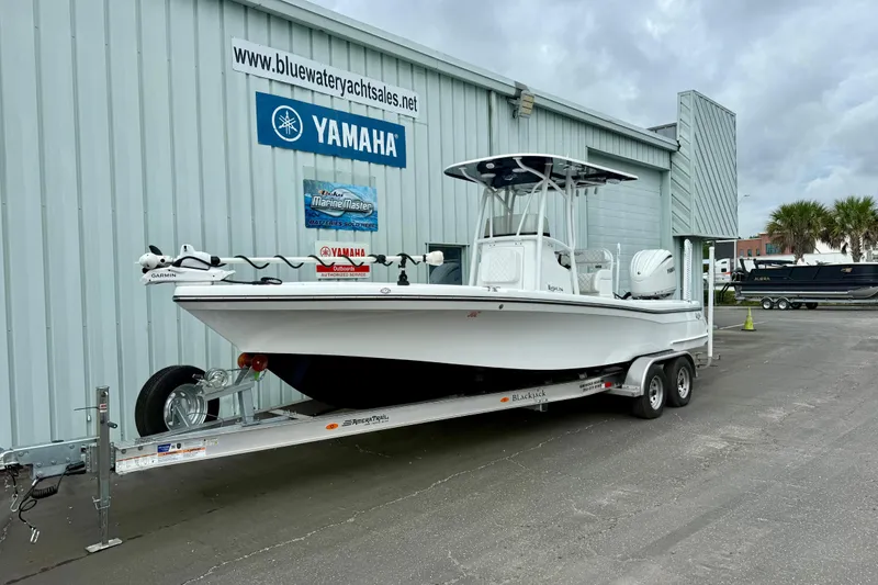 Slide: The Image of 2025 BlackJack 256 Coastal boat docked, featuring Garmin equipment, in a serene marina setting. - 12