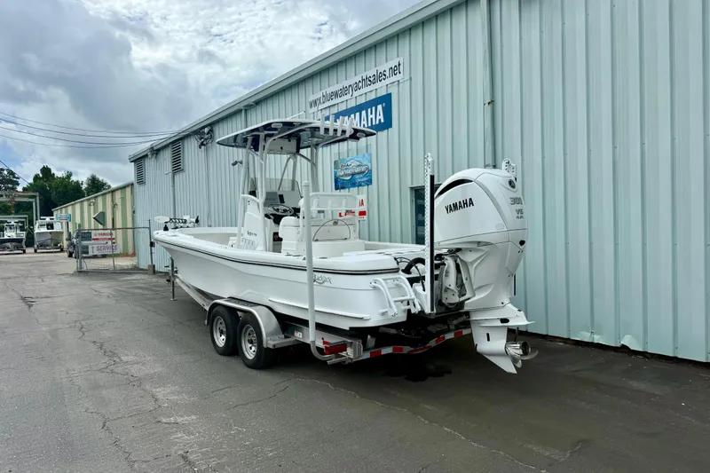 Slide: The Image of 2025 BlackJack 256 Coastal boat with Yamaha engine docked at marina. - 13