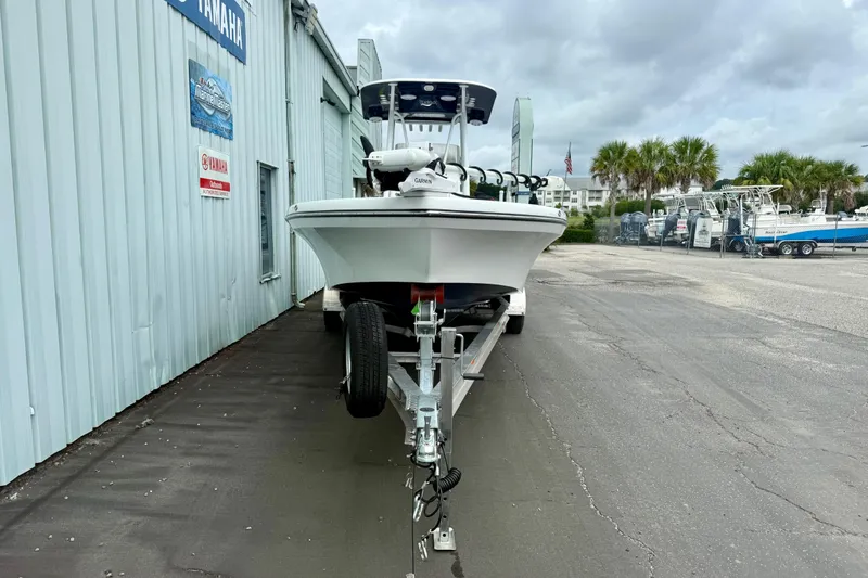 Slide: The Image of 2025 BlackJack 256 Coastal boat with Yamaha engine docked by the water. - 16