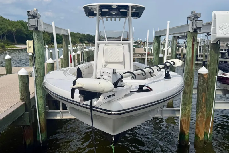 Slide: The Image of Manufacturer Provided Image: 2025 BlackJack 256 Coastal boat with rod holders and storage on deck. - 23