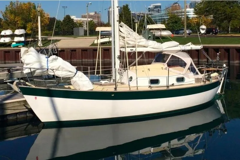 Slide: The Image of Sailboat docked in marina, 1996 Morris Yachts Frances model, reflecting on calm water. - 1