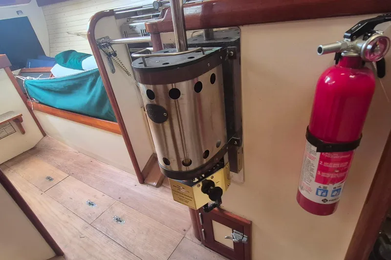 Slide: The Image of Interior of 1996 Morris Yachts Frances with heater and fire extinguisher. - 16