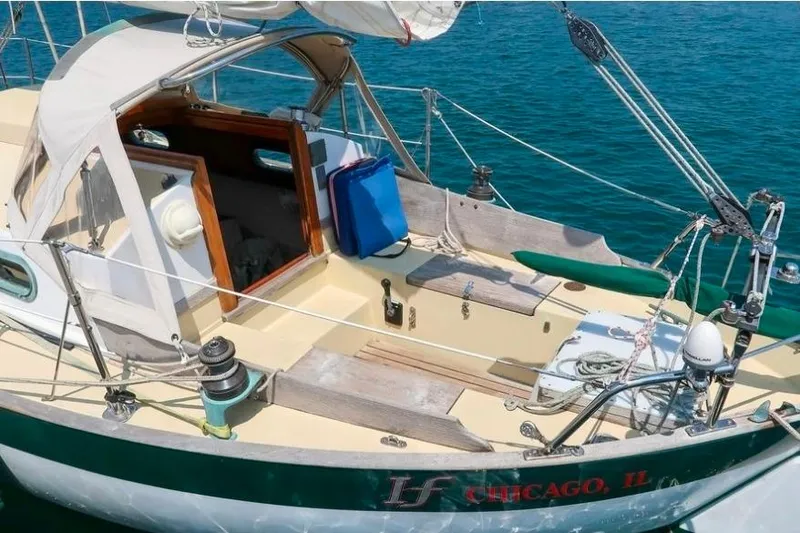 Slide: The Image of Sailboat deck of 1996 Morris Yachts Frances, moored in clear blue water. - 2