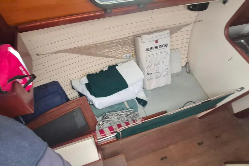 Slide: The Image of Interior of a 1996 Morris Yachts Frances, featuring storage and nautical equipment. - 23