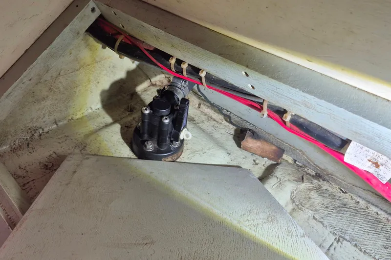 Slide: The Image of Bilge area of a 1996 Morris Yachts Frances, showing wiring and pump components. - 27