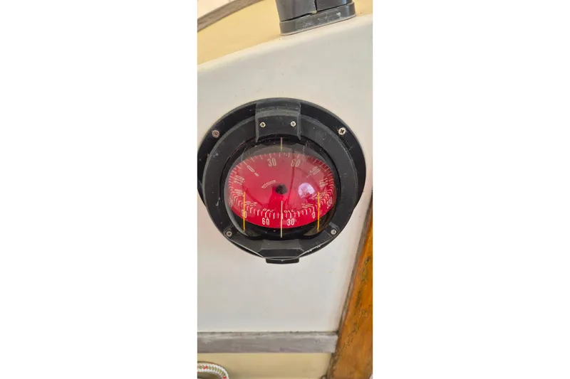 Slide: The Image of Compass on 1996 Morris Yachts Frances, displaying red directional dial. - 36