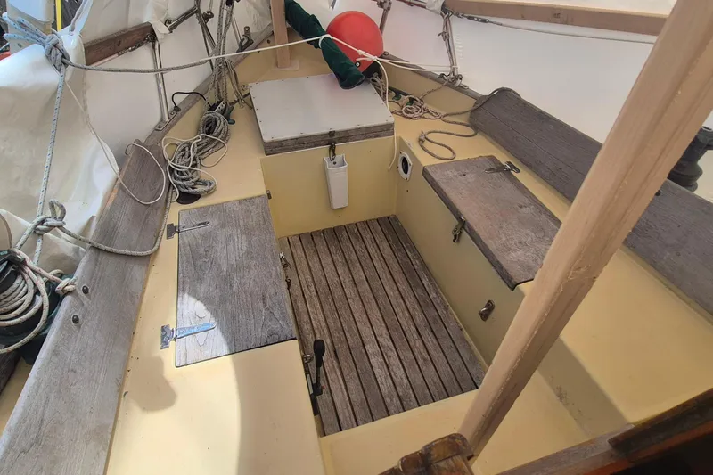 Slide: The Image of Cockpit of 1996 Morris Yachts Frances sailboat with wooden seating and nautical ropes. - 4