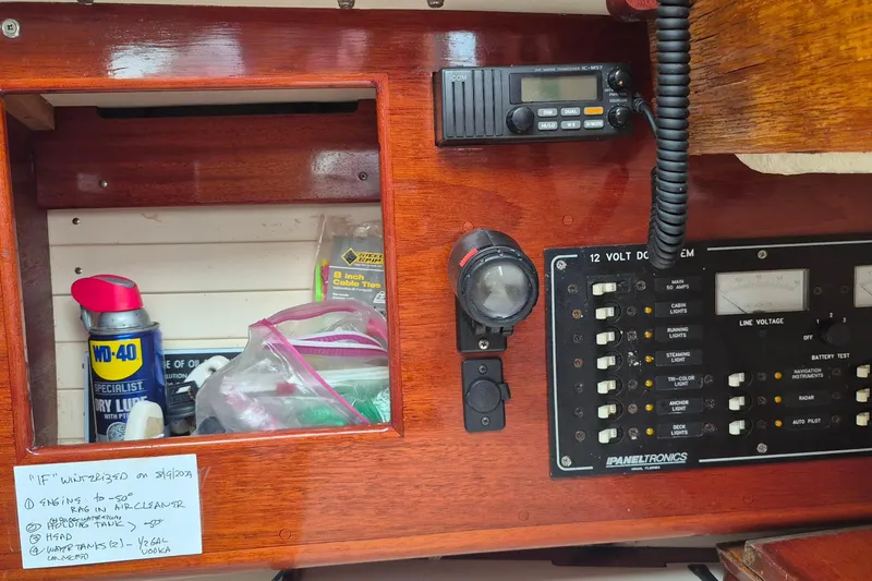 Slide: The Image of Control panel and storage on a 1996 Morris Yachts Frances, featuring tools and equipment. - 40