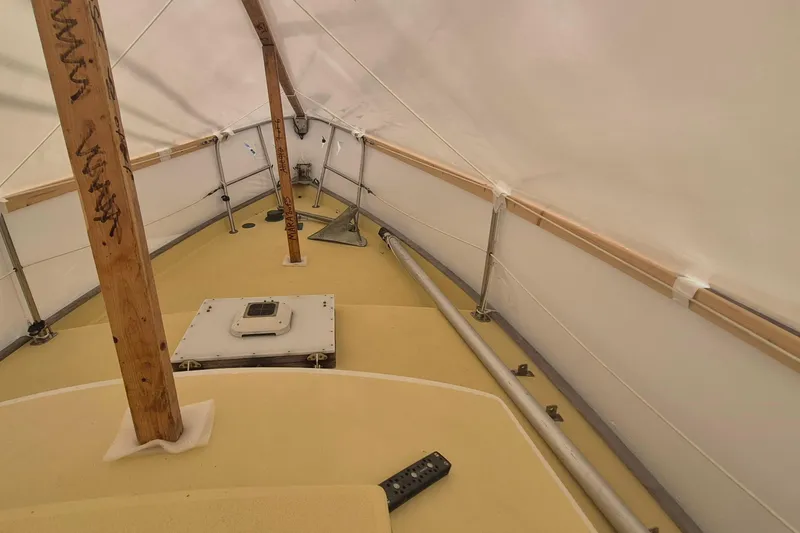 Slide: The Image of Interior view of a 1996 Morris Yachts Frances sailboat under a protective cover. - 42