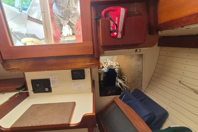 Slide: The Image of Interior of 1996 Morris Yachts Frances, featuring wooden cabinetry and a first aid kit. - 44