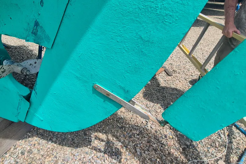 Slide: The Image of Close-up of 1996 Morris Yachts Frances rudder and propeller on gravel surface. - 48