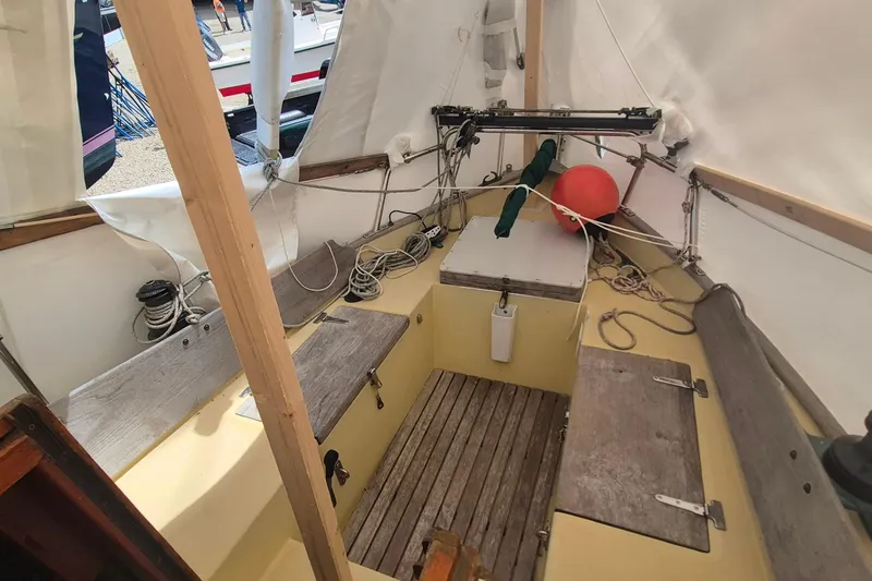 Slide: The Image of Interior view of a 1996 Morris Yachts Frances sailboat, showcasing seating and rigging. - 5
