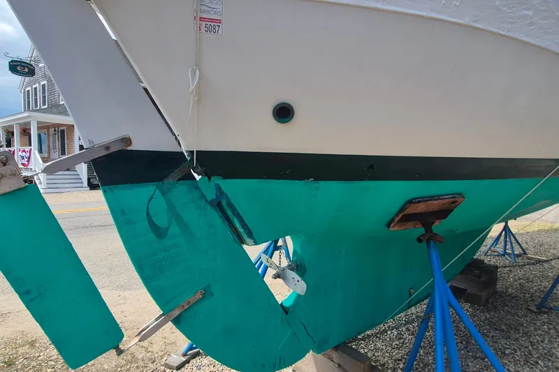 Slide: The Image of 1996 Morris Yachts Frances sailboat on stands, showing hull and rudder details. - 50