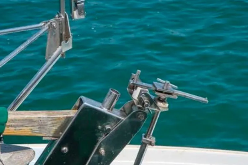 Slide: The Image of Close-up of Morris Yachts Frances 1996 sailboat hardware against blue water. - 55