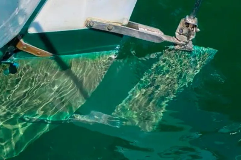 Slide: The Image of Rudder of 1996 Morris Yachts Frances submerged in clear green water. - 56
