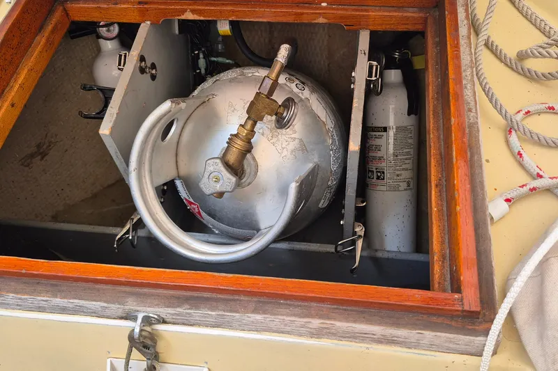 Slide: The Image of Propane tank storage on 1996 Morris Yachts Frances sailboat, featuring safety equipment. - 6