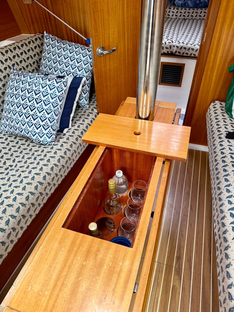 Slide: The Image of Interior of a 2000 Dufour 32 Classic yacht with kitchen and seating area. - 11