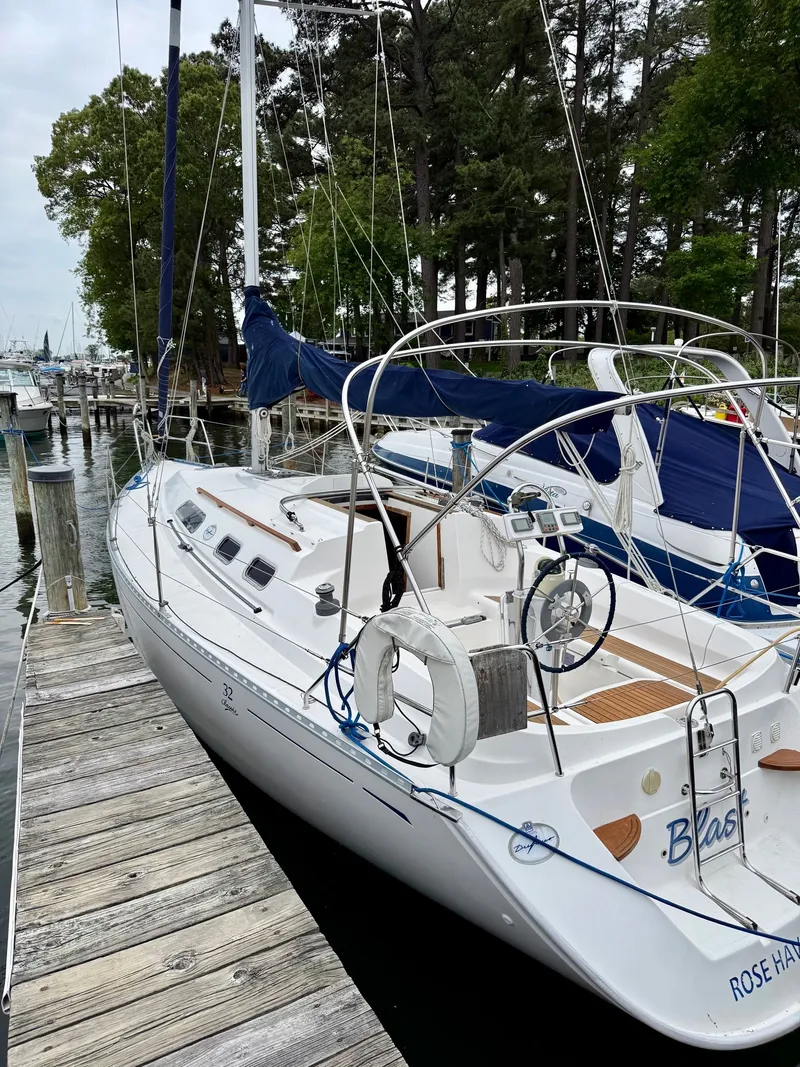 Slide: The Image of 2000 Dufour 32 Classic sailboat docked at marina. - 2