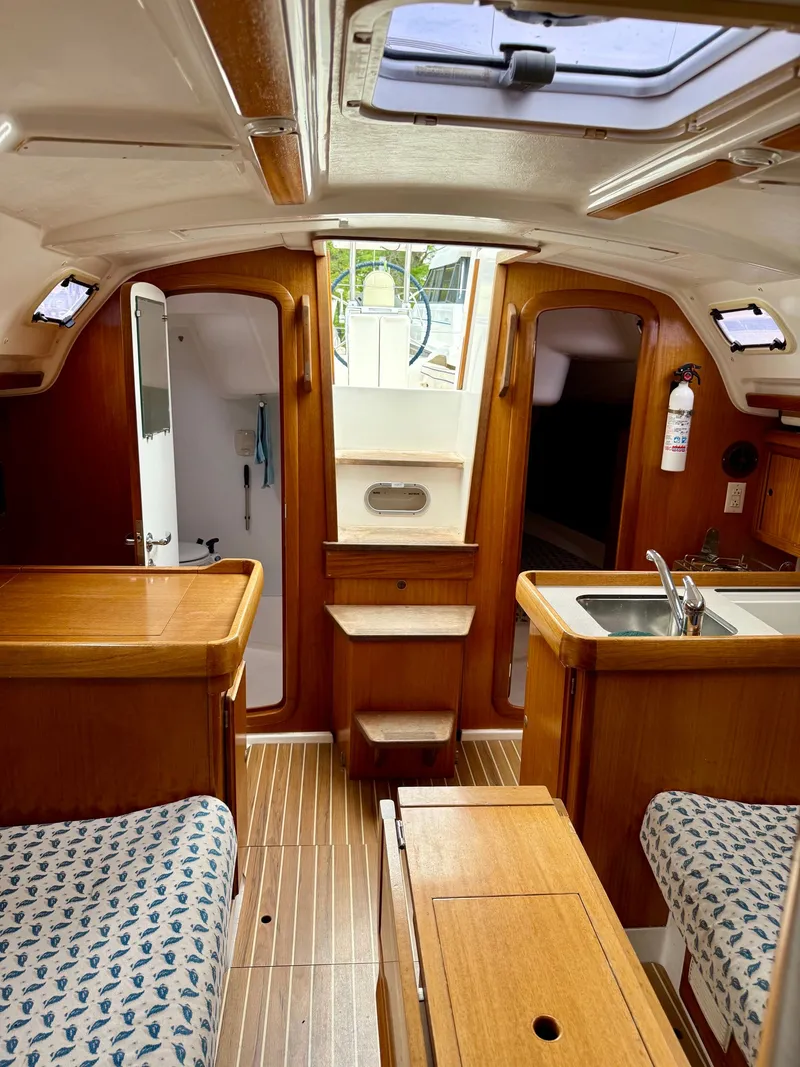 Slide: The Image of Interior of a 2000 Dufour 32 Classic yacht with wooden furnishings. - 20