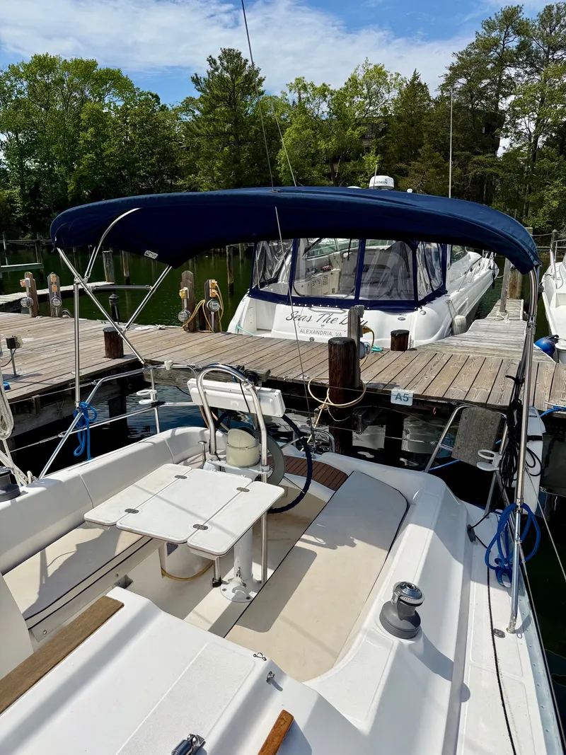 Slide: The Image of Dufour 32 Classic 2000 sailboat docked with blue canopy. - 6