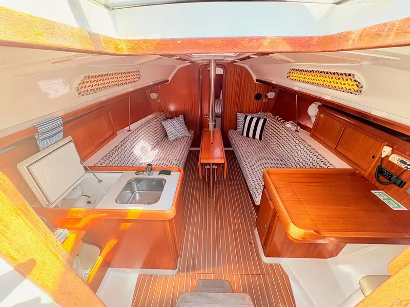 Slide: The Image of Interior of a 2000 Dufour 32 Classic yacht with wooden finish. - 8